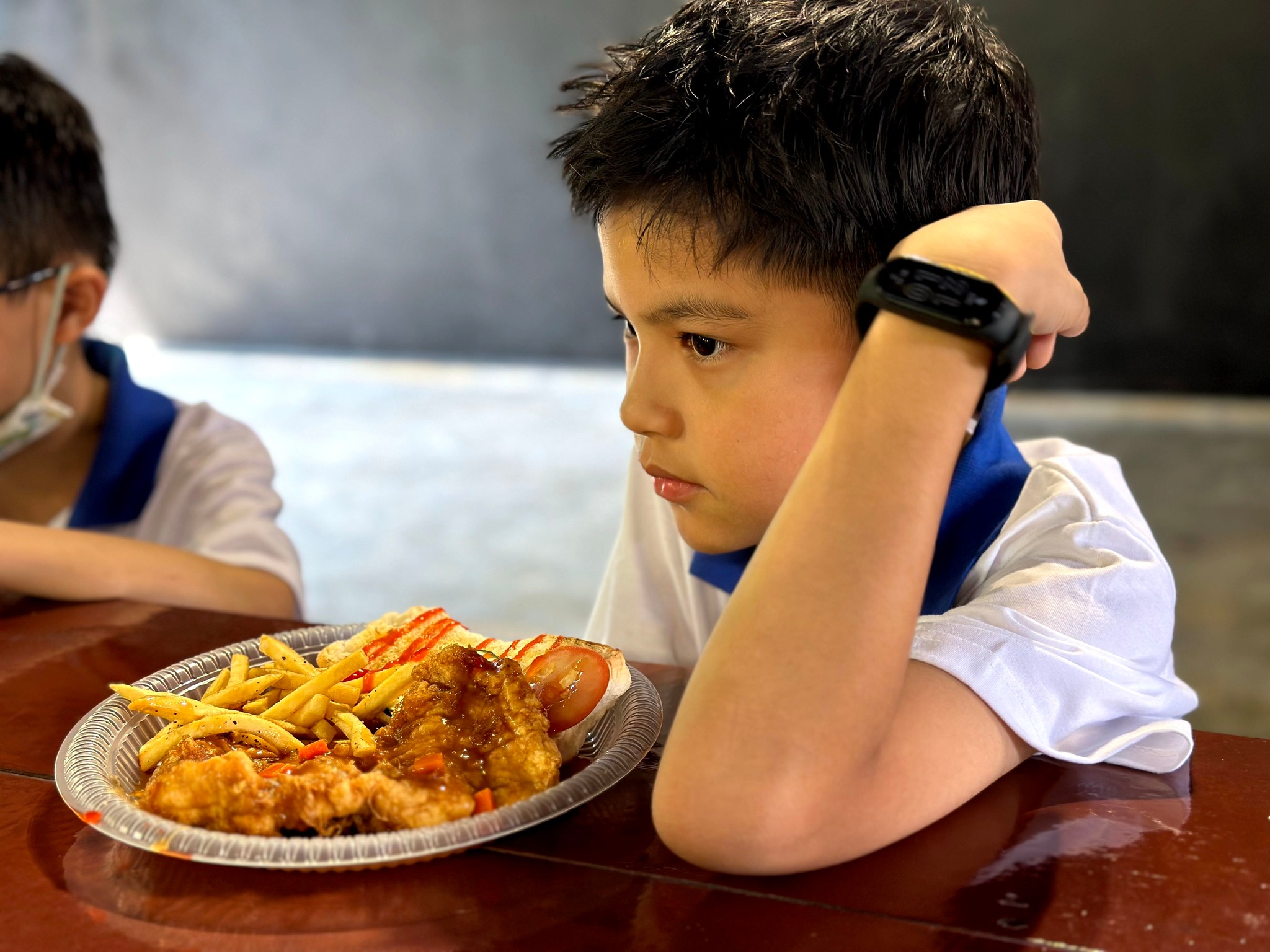Boy enjoying chicken chop